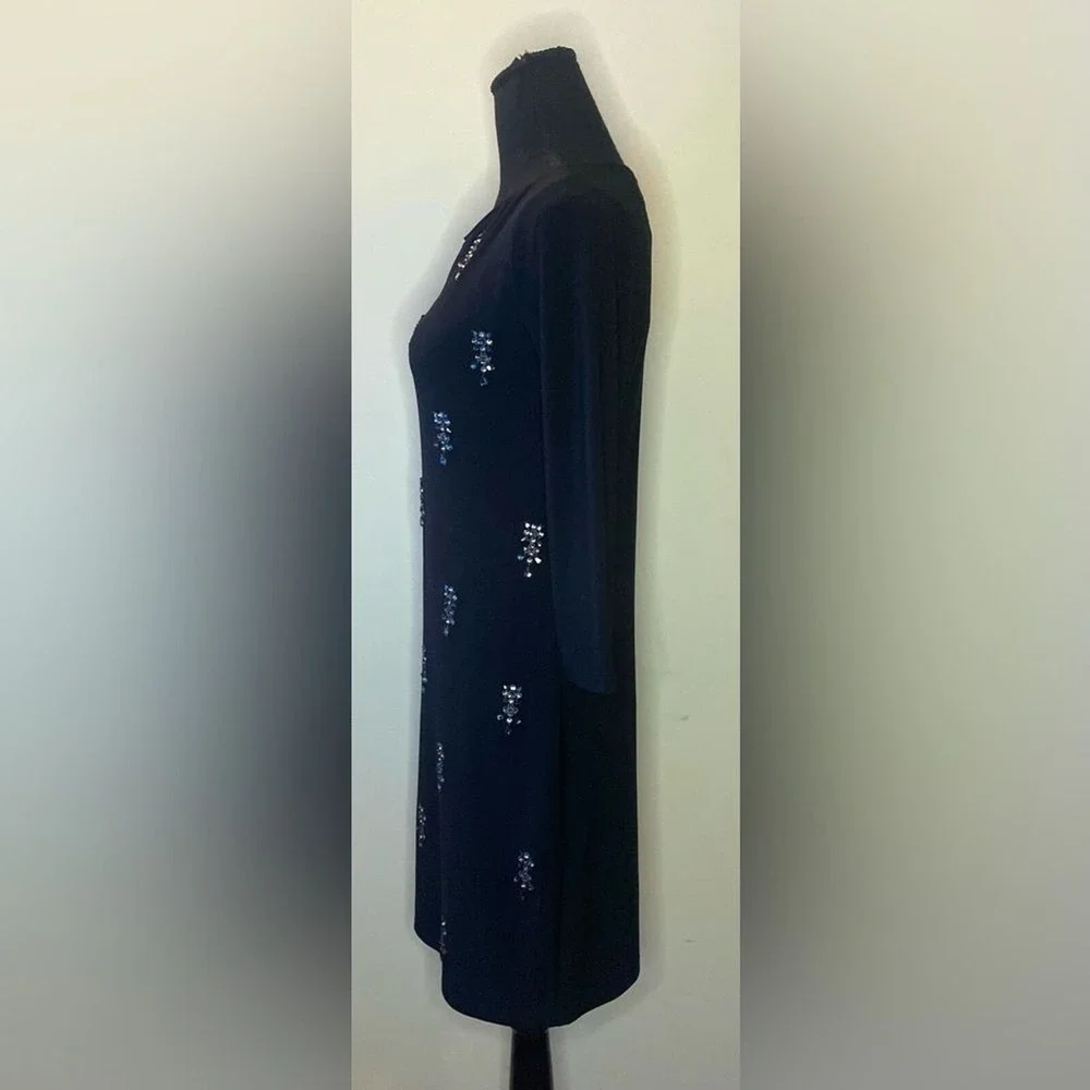 White House black market- Black mini dress with some‎ bedazzled detailing SizeXS